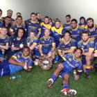 Otago players pose for a photo with the Donald Stuart Memorial Trophy after beating Southland in...