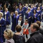 Otago Polytechnic nursing graduate Belinda Jones (centre) walks in the graduands' parade with...