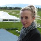 Otago Racing Club events and marketing manager Charlotte Neilson above the marquees being set up...