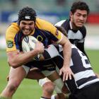 Otago's Ryan Shortland tries to break the the tackle of Hawkes Bay player Grant Webb. Credit:NZPA...