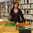 Otago Settlers Museum archivist Jill Haley yesterday boxes several volumes of information about...