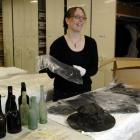 Otago Settlers Museum collections team leader Claire Nodder with some of the items uncovered...