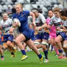 Otago Spirit centre Greer Muir is chased by a third of the Bay of Plenty side at Forsyth Barr...
