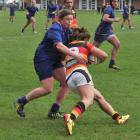 Otago Spirit hooker Lucy Emery wraps up Waikato halfback Patricia Garcia at the University Oval...