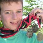 Otago swimming record holder Matt Henderson (11) is pleased with his medal haul at the Canterbury...