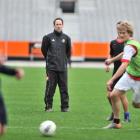 Otago United coach Richard Murray leads his team in training at Forsyth Barr Stadium. Photo by...