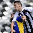 Otago United's  Regan Coldicott (left) and  Aaron Jones, of Hawkes Bay, compete for the ball...