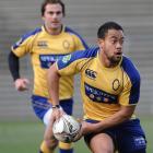 Otago winger Buxton Popoali'i looks to move the ball in training at Carisbrook on Thursday....
