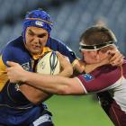 Otago winger Ryan Shortland tries to fend off of Southland prop Chris King during the teams' Air...