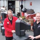 Out with the old: The Warehouse South Dunedin employee Ronald Cochrane (left) and store manager...