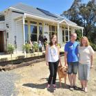Outside a relocated and renovated 99-year-old villa in East Taieri this week are  new residents ...