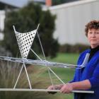Owaka Going Forward chairwoman Aileen Clarke  displays a model of the waka sculpture being built...
