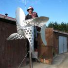 Going for a spin . . . Wind power enthusiast John McCabe shows his new wind turbine sculpture,...