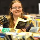 Paige Samson checks her last-minute bargains  at the end of  the Regent 24-hour Book Sale on...