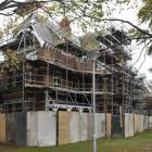 Painters continue maintenance work on the University of Otago professorial houses, north of the...