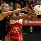 Pamela Cookey of England (R) and Casey Williams of New Zealand compete for the ball during their...
