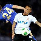 Paolo Guerrero (R) of Corinthians fights for the ball with Gary Cahill of Chelsea during their...