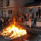 Partygoers celebrate the All Blacks' Rugby World Cup win with a fire in Hyde St, Dunedin, last...