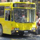 Passengers board a yellow Connectabus at the Camp St stop, in central Queenstown. Photo by  Naeem...