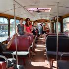 Passengers enjoy riding on a restored bus in Dunedin yesterday. Photo by Gerard O'Brien.