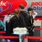 Passengers line up to check in for a flight to Auckland yesterday at Dunedin International...