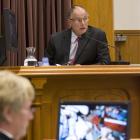 Pathologist Dr Alexander Dempster in the stand during the David Bain murder retrial in the High...