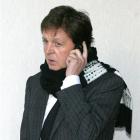 Paul McCartney is shown using his mobile phone in this file photo.(AP Photo/Dominic Lipinski/PA,...