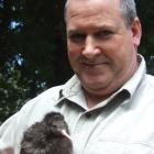 Paul Wilson holds the park's 12-day-old  kiwi. Photo by Joe Dodgshun.