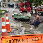 Peak Power linesman Izaac Hollegien, of Wanaka, removes cobblestones to make way for new street...