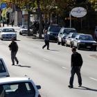 Pedestrians cross George St, near of the intersection with Albany St, just south of where an...