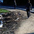 Pedestrians negotiate a storm-damaged section of the Otago Peninsula cycleway beside Portobello...