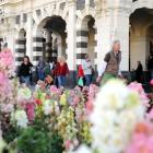 Pedestrians walk to work from the Dunedin Railway Station after catching a train that ran from...