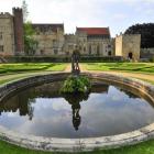 Penshurst Place and Gardens viewed from the Italian Garden, after the pond featuring a statue of...