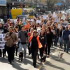 People and their pets march in George St, Dunedin, yesterday in protest against recreational...
