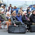 People listen to a band play at the Christmas market. Photos by Gregor Richardson.