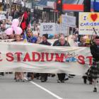 People march up George St in Dunedin on Saturday to protest against ratepayer funding for a new...