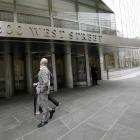 People walk past the Lower Manhattan headquarters of Goldman Sachs.