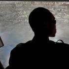 Performance artist Samin Son, of South Korea, transcribes words from Michel Foucault's book...