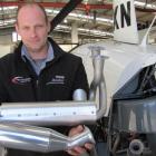 Performance Aviation director Matt Bailey holds a new Power Flow exhaust system for Robinson 22...