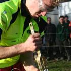 Peter Gardyne representing Otago-Southland, strains a fence during yesterday's practical section...
