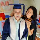 Peter Reid's art frames him and his daughter Jody. They both graduate today with teaching and...