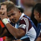 Peter Saili of the Blues celebrates a try from the bench during the round 3 Super Rugby match...