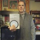 Peter Small with the Guide to the Bodhisattva's Way of Life by Shantideva. Photo by Nigel Benson.