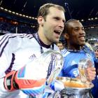 Petr Cech (L) and Didier Drogba of Chelsea celebrate with the Champions League trophy after...