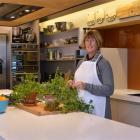 Petrina Robinson tidies up her herbs, which make a nice feature in her cookery classroom at Green...