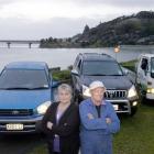 Taieri Mouth couple Helen and Ross Oldham with the three vehicles they own. Photo by Jane Dawber.