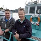 Phil (left) and Sean Heseltine both work on the ocean, Phil offshore on  Polaris II and Sean...