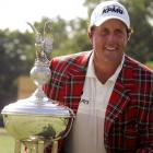 Phil Mickelson poses with the Marvin Leonard trophy after winning the Colonial golf tournament in...