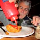 Jim Russell gets ready to tuck into a deep-fried Jimmy's pie. Photos by ODT