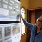 Phyllis Munro, of South Dunedin, considers one of the redevelopment choices for the retail centre...